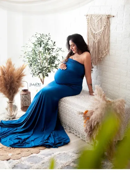 A solo portrait is a must. This mama chose a gorgeous royal blue mermaid gown from my collection, and she looks absolutely radiant in my boho-themed studio setup.