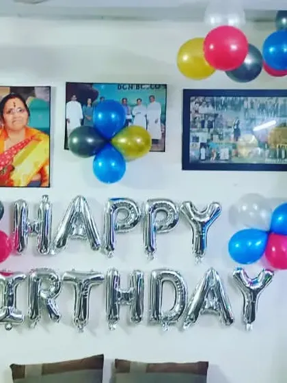 A heartfelt and personal birthday decoration at home. We arranged the "Happy Birthday" foil letters around the family's photo frames, making the decor truly part of the home.