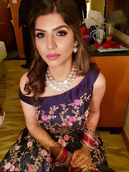 A close-up showcasing the detailed eye makeup. The blend of neutral shadows with a sharp liner creates a sophisticated and glamorous look perfect for any evening event.