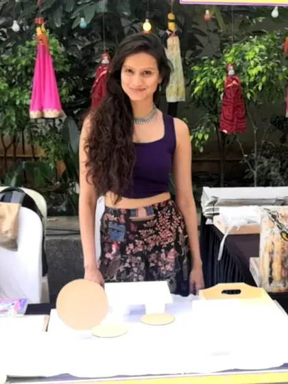 This is me in my element, ready to welcome guests at my art stall. I bring everything needed to make your event memorable, from canvases and paints to a friendly, guiding hand.
