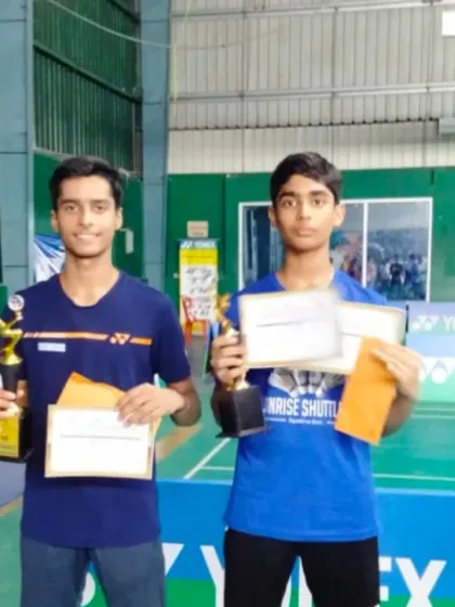 A closer look at two of our winners from the U.P. State Tournament, holding their certificates and trophies. We focus on developing both singles and doubles specialists.