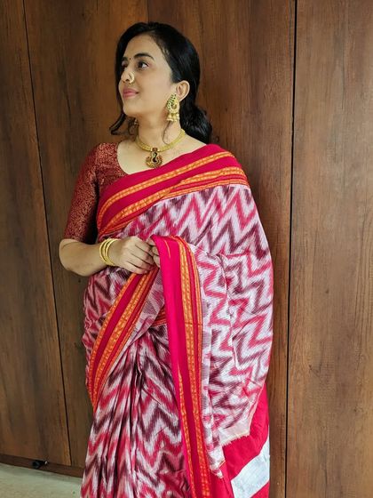 Our new festive launch includes this stunning red and white Ikat saree. The chevron pattern is bold and modern, while the colors are traditionally festive.