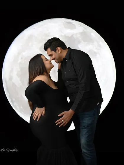To the moon and back. This romantic portrait uses my custom moon prop to create a magical, dreamy setting for couples to celebrate their journey together under the stars.