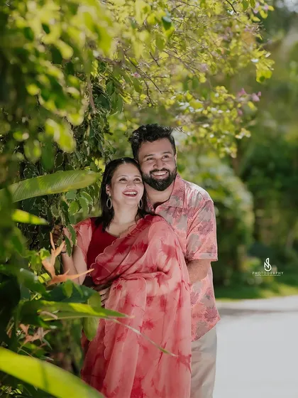 A happy, laughing embrace among the tropical plants. The genuine joy in this photo is contagious.