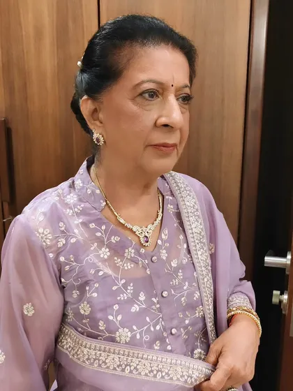 It’s an honor to get the mother of the bride ready. For her, we chose an elegant and sophisticated look with soft, defined eyes and a neutral lip color that complements her beautiful lavender outfit. The goal for mature skin makeup is always to enhance, not conceal, creating a graceful and timeless appearance.