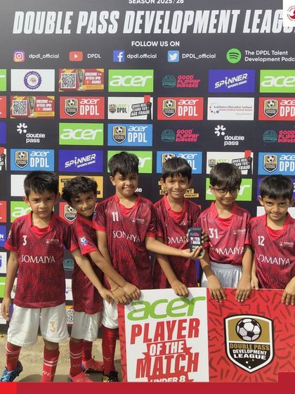 The Somaiya FC U-8 team celebrates with their Man of the Match, Dhiaan Mehta, after a victory in the DPDL.
