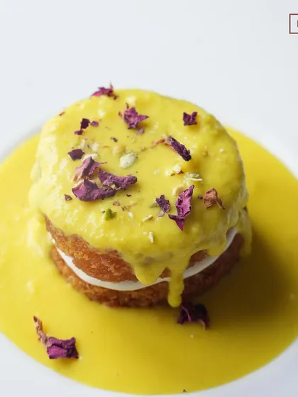 A top-down view of our Shahi Tukda, garnished with dried rose petals and pistachios. This dessert is a feast for the senses, full of rich, sweet, and aromatic flavours.