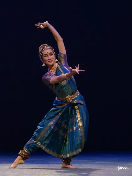 The flowing lines of the body and costume create a sense of grace and movement, even in a still photograph.