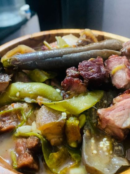 A beautiful bowl of smoked pork curry, cooked with fresh vegetables and herbs from my garden.