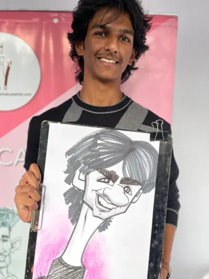 A student from Fergusson College with his caricature. I love the energy of drawing at college events.
