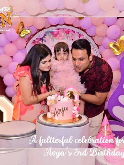 The magical cake-cutting moment at Avya's 3rd birthday. The family gathers around the beautiful butterfly-themed cake, creating a memory to cherish forever.