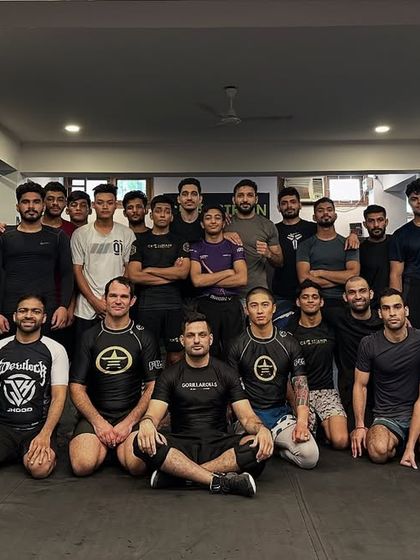 The team after a game-changing seminar on cage wrestling with Coach Eliot Kelly. The learning never stops.