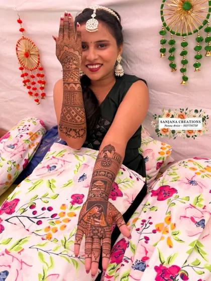 A playful pose from the bride, giving a peek at her stunning full-arm bridal mehndi.
