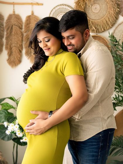 A classic and loving pose. The partner embracing the mumma-to-be from behind is a timeless way to photograph a couple during their maternity journey.