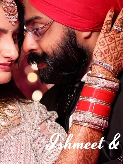 An intimate close-up of a Sikh couple during their reception. The focus is on the bride's beautiful henna and chooda as she embraces her partner, showcasing the rich traditions and emotions of a Punjabi wedding.