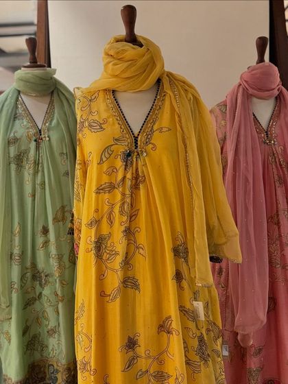 A beautiful collection of printed kurtas in pastel green, yellow, and pink, styled with sheer dupattas for a light, festive feel.