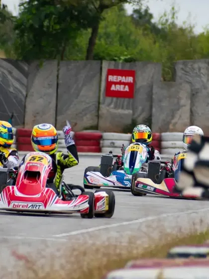 Hunner Singh takes the checkered flag, leading a train of karts to the finish line, a testament to his skill and the performance of our equipment.