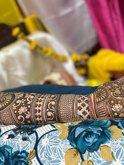 A finished full-arm design laid out, showing the beautiful contrast and flow of different patterns.