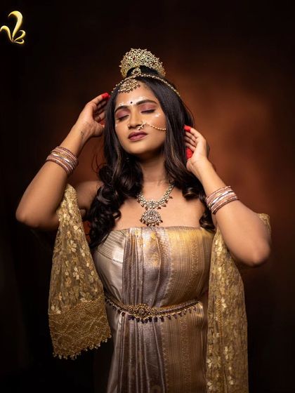 A powerful pose from the Shailaputri shoot. The off-shoulder draped gown and intricate headpiece are styled to convey a sense of quiet strength and grace, reflecting the goddess born from the mountains.