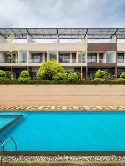 For this residential community, we designed an open-to-sky swimming pool that feels like a private, serene retreat. Using clean lines, layered planting for privacy, and a minimal material palette, we created a peaceful focal point that integrates seamlessly with the surrounding architecture.