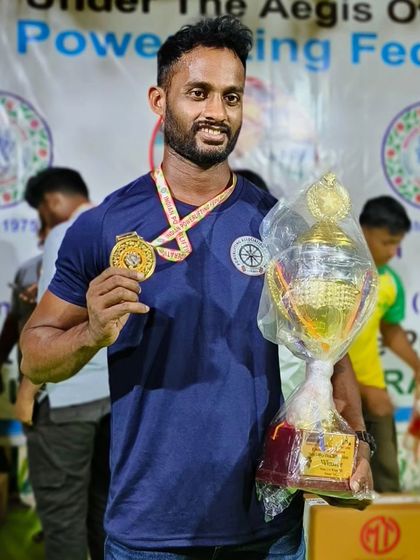 Another shot of the Senior Strongman champion. The hardware is proof of the hard work we put in at the gym.