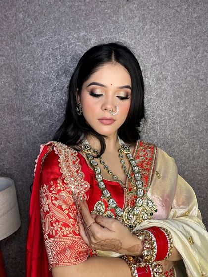 Another angle focusing on the intricate details of the bridal makeup and jewelry.
