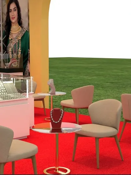 A duplicate of image 8, this angle shows the flow within the stall. The placement of chairs and small tables creates pathways for visitors to move around, while ensuring there is enough space for showcasing jewelry on display stands.