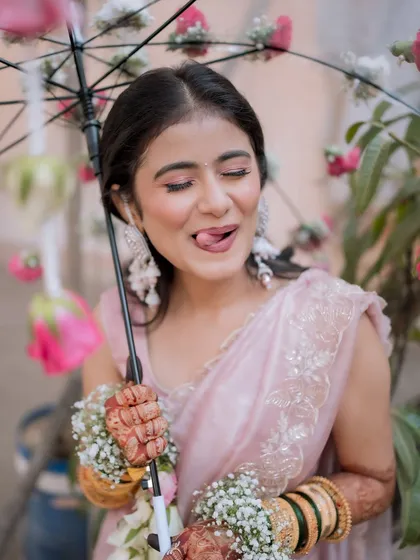 Another fun shot from the Haldi ceremony. The makeup is designed to be waterproof and long-lasting, even through all the playful rituals.