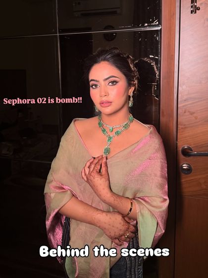 A behind-the-scenes shot of this glamorous look. Even before the final touches, the makeup is already making a statement.