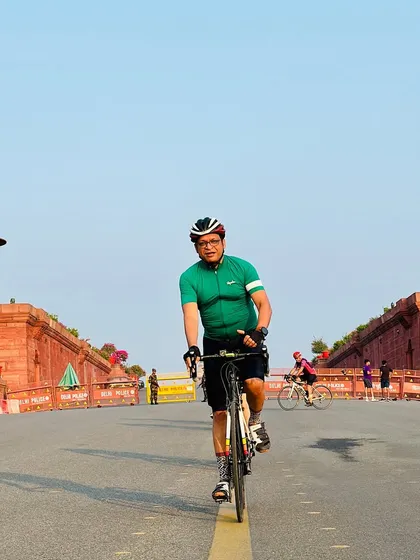 A head-on shot of a rider, capturing the symmetry of the road.