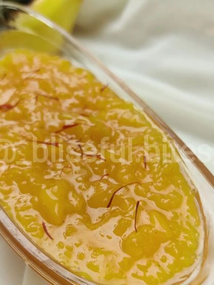 A close-up of my Aam ka Murabba (sweet mango preserve), garnished with delicate saffron strands. This is a traditional summer condiment made with fresh raw mangoes.