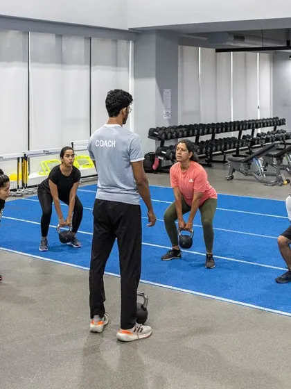 Our Strength Training for Runners program focuses on building a resilient and powerful body. Here, our coach guides a group through kettlebell exercises designed to improve running economy and prevent injuries. We believe in training smarter to help you achieve your running goals.