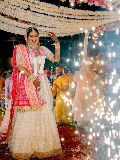 The bride's grand entrance, surrounded by the sparkle of cold pyros, making her feel like a true star.