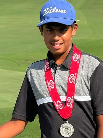 A close-up of Rayirth Jain with his 2nd place medal from the US Kids tour.