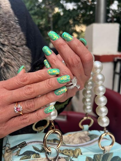 This vibrant green and gold foil nail art is perfect for festive occasions like Diwali or a wedding celebration. The color is rich and celebratory, and the gold flakes add a touch of traditional glamour.