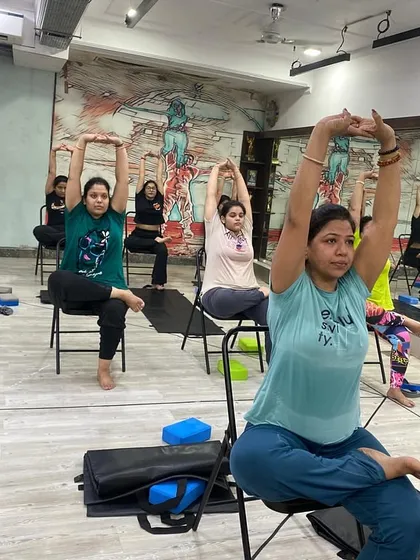 A seated stretch that helps open the shoulders and chest, improving posture and releasing tension.