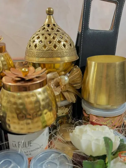 A close-up of the brass items in our Glitterati hamper, including a beautiful brass burner and hammered-finish jars that add a touch of traditional luxury.