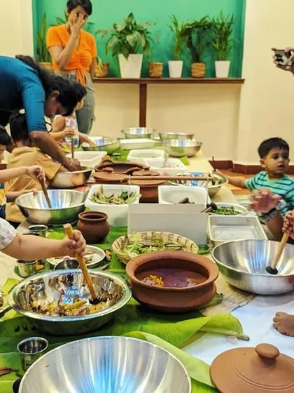 There is so much joy in mixing and making. Here, our little adventurers are busy creating their own nature potions at a sensory table. Using leaves, twigs, sand, and a lot of imagination, this parent-child activity is all about hands-on, collaborative fun.