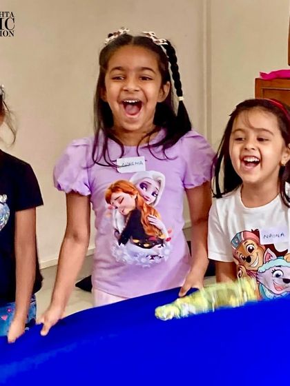 The pure joy and laughter of children fully engaged in a music activity. This is the heart of what we do at the foundation.