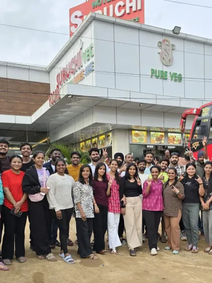 A pit stop on the highway. The journey starts with everyone gathering, and our bus is ready to take you to the mountains.