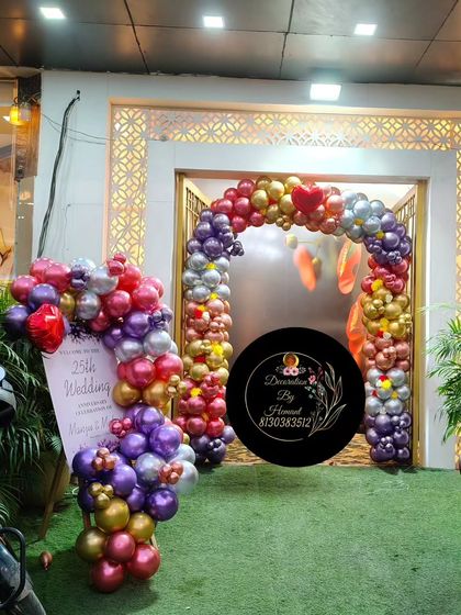 The entrance to the 25th-anniversary party venue. I created a balloon arch over the doorway and a matching welcome display to ensure the celebration started from the moment guests arrived.