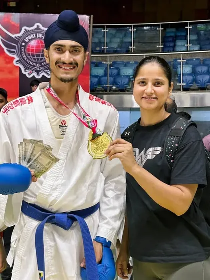 With my mentor and senior, Deepika Didi, after winning the India Open International Karate Championship. Her guidance has been crucial in polishing my skills and aptitude for the sport.