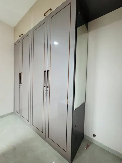 A perspective shot showing the full height of the wardrobe with its overhead loft storage.