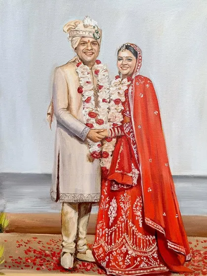 A close-up of the happy couple from the live wedding painting in Goa. Their smiles and traditional attire are the centerpiece of this artwork.