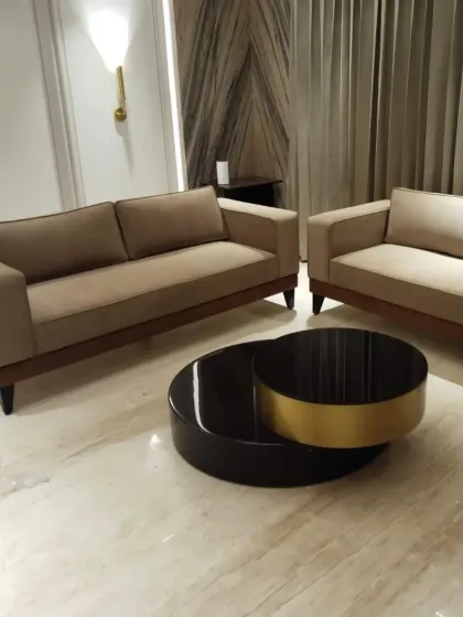 A wider view of a living room set we designed, including two sofas and a statement coffee table. This shows how we approach creating a complete and balanced furniture arrangement for a space.
