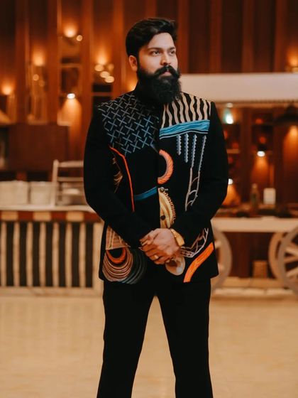 A close-up of our client in the abstract art bandhgala. His powerful presence is a testament to wearing an outfit that is truly a piece of art.