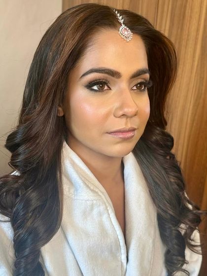 The concentration before the final reveal. Creating the perfect winged liner and soft smokey eye is a key part of my signature style.