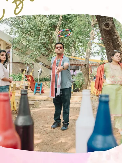 The 'Ring the Bottle' game in action. Classic carnival games are a simple and effective way to add a layer of interactive fun to any pre-wedding celebration.