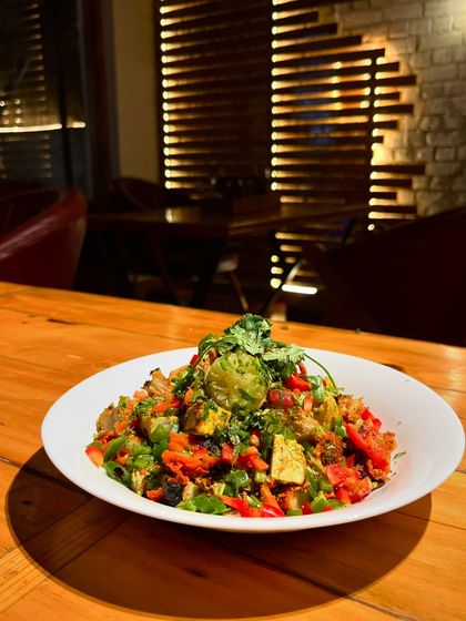 A bowl full of health and flavor. This is our fresh vegetable salad, a light and delicious option.