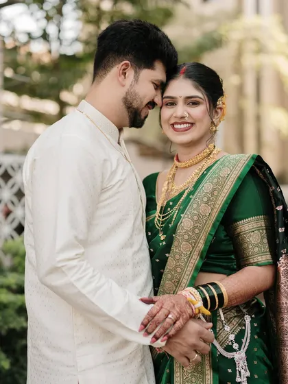 A sweet and gentle moment of connection. The groom's embrace from behind creates a sense of warmth and security, beautifully captured in this portrait.